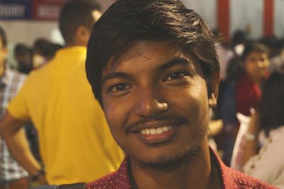 Close-up portrait of smiling young man