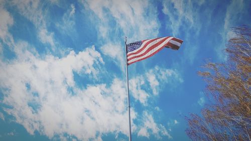 Low angle view of flag against sky