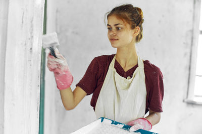 Portrait of young woman working at office