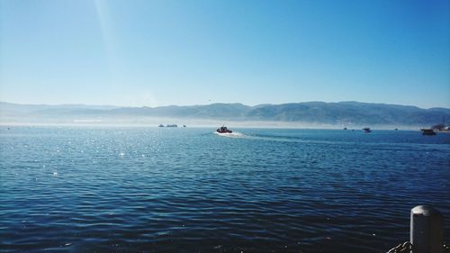 Scenic view of sea against blue sky