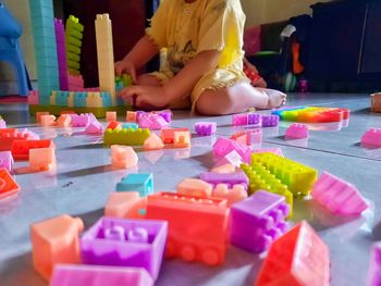 Boy playing with toy toys on table