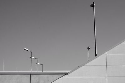 Low angle view of street light against building