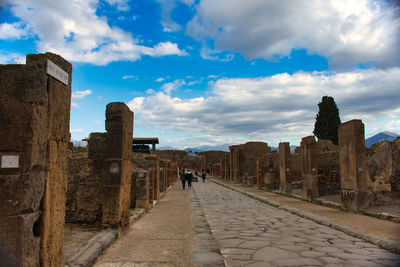 Old ruin buildings against cloudy sky