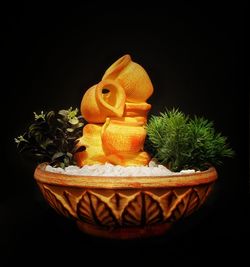 Close-up of artificial pumpkin against black background