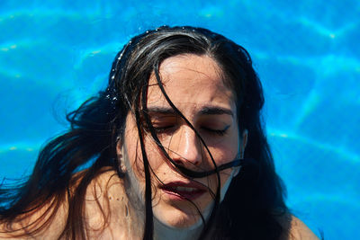 Portrait of young woman in swimming pool