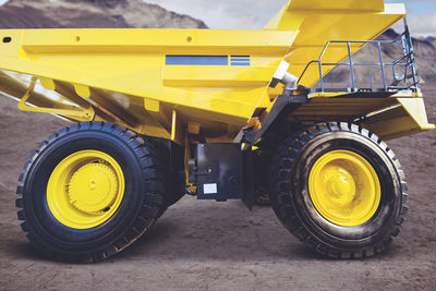 Yellow construction machinery on field