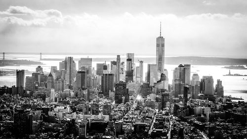 Cityscape against cloudy sky