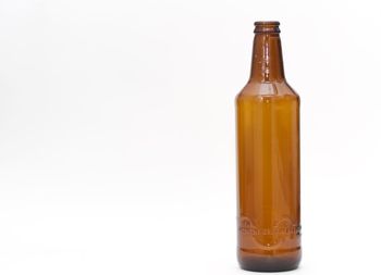 Close-up of bottle against white background