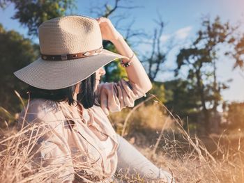 Woman wearing hat on field