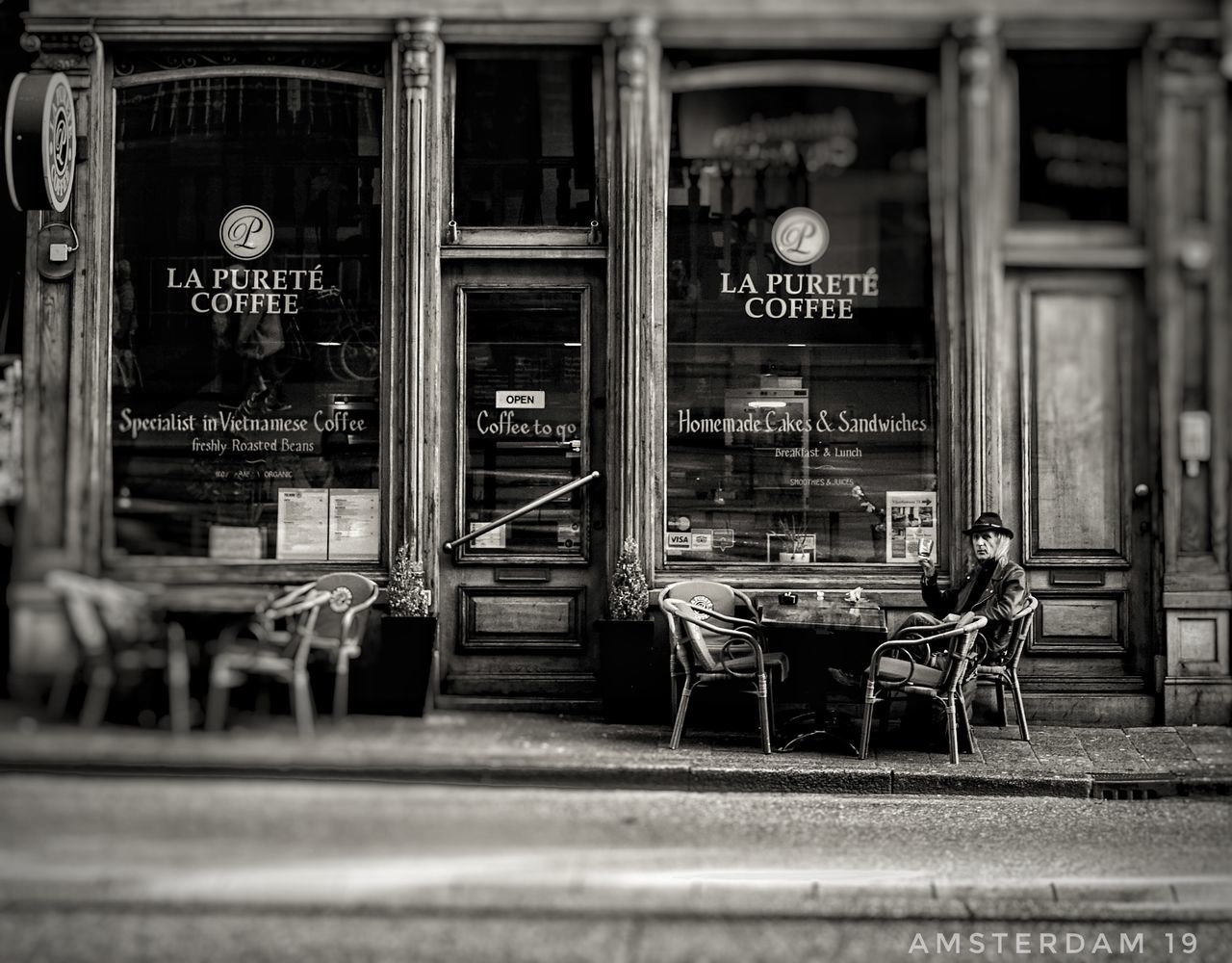 architecture, seat, text, communication, chair, cafe, no people, sign, building exterior, built structure, outdoors, day, business, table, information, empty, restaurant, western script, script, window