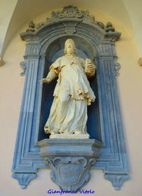 Low angle view of statue against temple