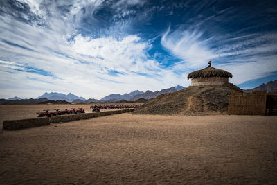 View of castle against cloudy sky