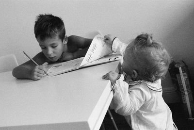 Shadow of boy holding book