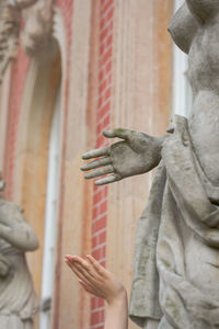 Low angle view of statue against building