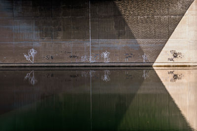 Full frame shot of building wall by lake