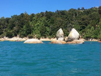 Scenic view of sea against clear blue sky