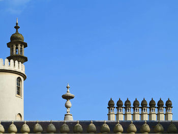 Low angle view of historical building against clear blue sky on sunny day