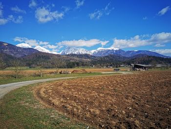 Scenic view of field against blue sky