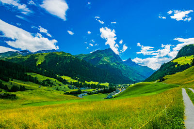 Scenic view of landscape and mountains against sky