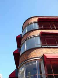 Low angle view of building against clear blue sky