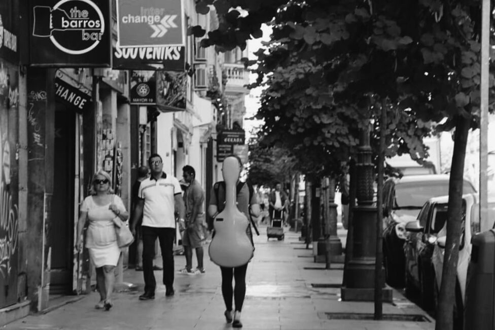 PEOPLE WALKING ON ROAD