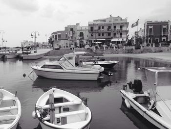 Boats moored at harbor
