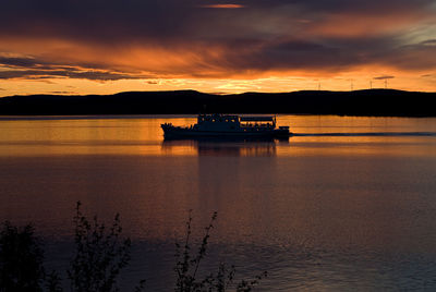 Scenic view of sea against orange sky