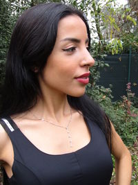 Portrait of a beautiful young woman looking away