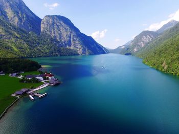 Scenic view of calm lake against mountain range