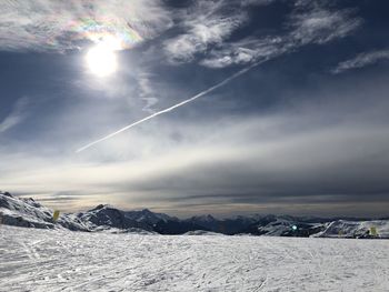 Scenic view of snowcapped mountains against sky