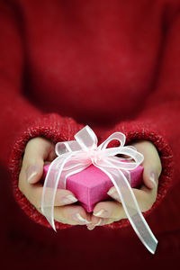 Close-up of human hand holding heart shape