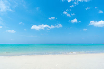 Scenic view of sea against blue sky