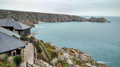 High angle view of sea and buildings against sky