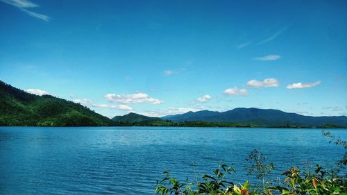 Scenic view of lake against blue sky