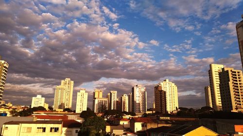 Buildings in city against sky