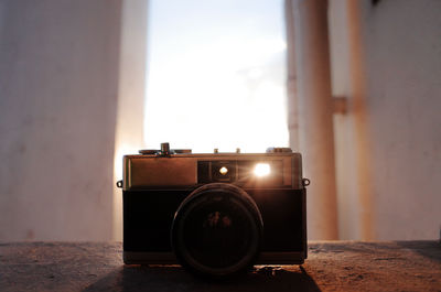 Close-up of vintage camera on table