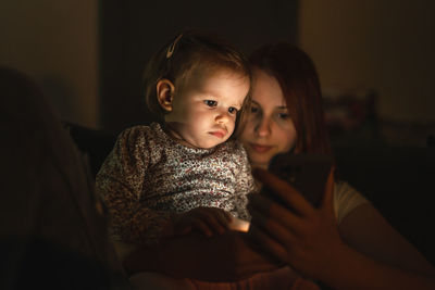 Portrait of young woman at home