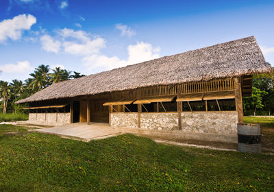 House on field against sky