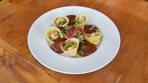 High angle view of salad served in plate on table