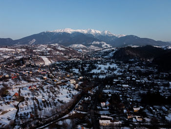 Bucegi mountains seen from the city of bran, romania. beautiful winter landscape. 