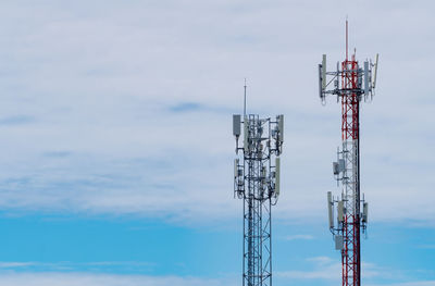 Telecommunication tower with blue sky and white clouds. antenna on blue sky. 