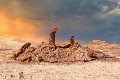 Scenic view of desert against sky during sunset