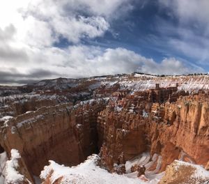 Aerial view of rock formation against sky during winter