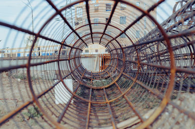 Directly below shot of spiral staircase against sky