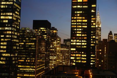 Illuminated buildings in city at night