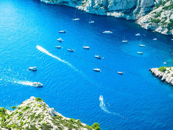 High angle view of sailboats in sea