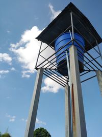 Low angle view of windmill against sky