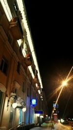 Low angle view of illuminated building at night