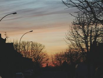 Silhouette trees against sky during sunset