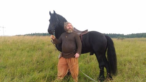 Full length of man on field